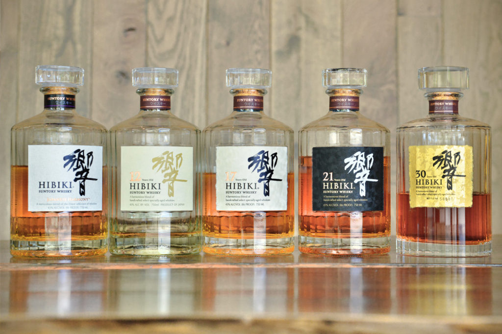 a lineup of Hibiki Whisky bottles