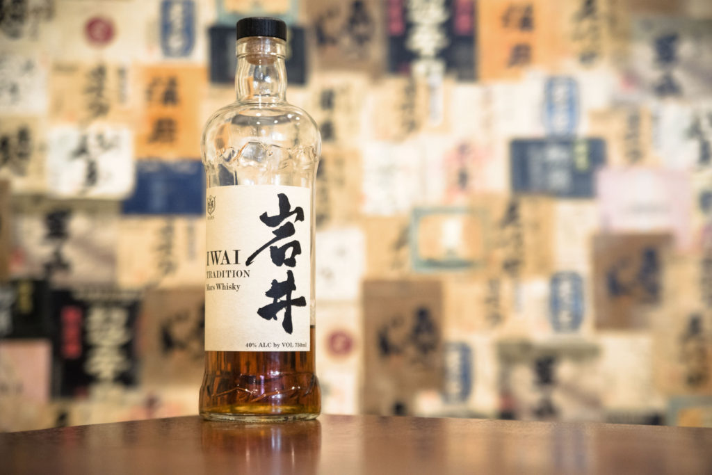 A bottle of Mars Whisky in a colorful izakaya.